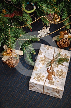 A variety of wrapped gifts under a festively decorated Christmas tree. Life style