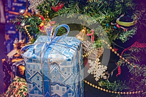 A variety of wrapped gifts under a festively decorated Christmas tree. Life style