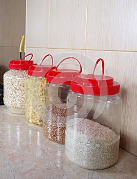 Varios dry food, seeds in bottles photo