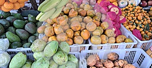 Varios tropical fruits on sales market photo