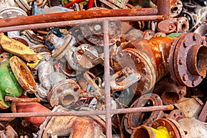 Various aged rusted parts of obsolete equipment at junkyard