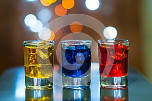 Various alcoholic cocktails on a bar counter with