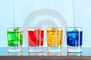 Various alcoholic cocktails on a bar counter with