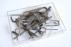 Various Allen keys in a perspex container. photo