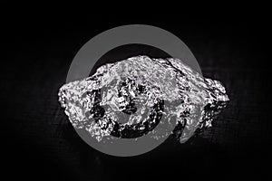 Various aluminum nuggets on black isolated background