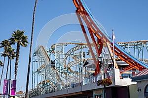 Various amusement park rides at Santa Cruz Beach Boardwalk during summer