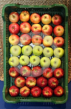 Various apples in crates at farmers market