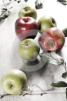 Various apples on a wooden tabletop