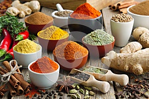 Various aromatic colorful spices and herbs. Ingredients for cooking, Ayurveda treatments photo