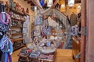 Various artistic antique items in handicraft shop for sale in city