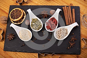 Various assorted seeds, dried berries and spices for the holiday cookies