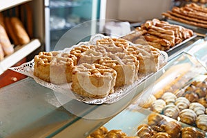 Various baked sweet cookies on bakery showcase
