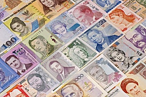 Collection of banknotes from different countries displayed on a table