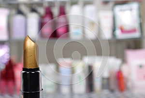 Various Beauty Products in shopping basket with blurred cosmetics