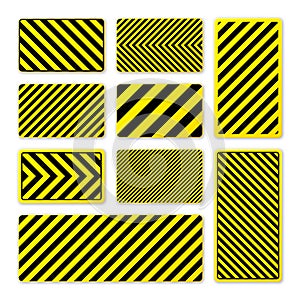 Various black and yellow warning signs with diagonal lines. Attention, danger or caution sign, construction site signage