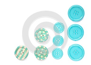 Various blue sewing buttons isolated on white background