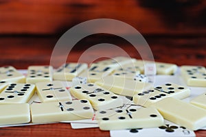 Various board games chess board, playing cards, dominoes.