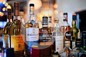 Various bottles of alcoholic beverages in the bar