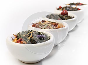 Various bowls of premium tea leaves