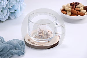 Various bowls of premium tea leaves blends, over white