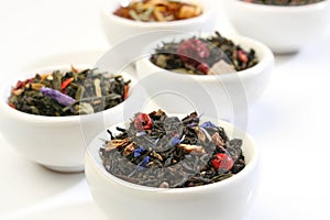 Various bowls of premiun tea leaves blends