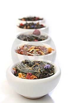 Various bowls of premiun tea leaves blends