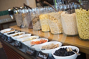 Various breakfast cereals on line buffet in hotel