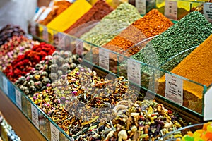 Various bright colored powder spices and fruit herbal tea and dried vegetables on market in Istanbul, Turkey