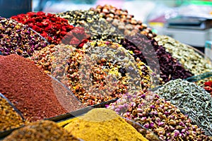 Various bright colored powder spices and fruit herbal tea and dried vegetables on market in Istanbul, Turkey