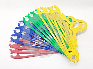 Various Bright Colorful Plastic Hanger for Clothes Drying Room Appliances in White Isolated Background 04