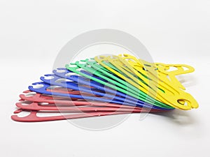 Various Bright Colorful Plastic Hanger for Clothes Drying Room Appliances in White Isolated Background 05