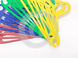 Various Bright Colorful Plastic Hanger for Clothes Drying Room Appliances in White Isolated Background 06