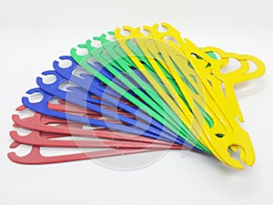 Various Bright Colorful Plastic Hanger for Clothes Drying Room Appliances in White Isolated Background 07