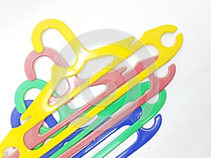 Various Bright Colorful Plastic Hanger for Clothes Drying Room Appliances in White Isolated Background 09