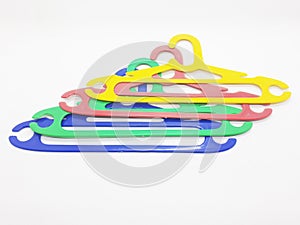 Various Bright Colorful Plastic Hanger for Clothes Drying Room Appliances in White Isolated Background 13