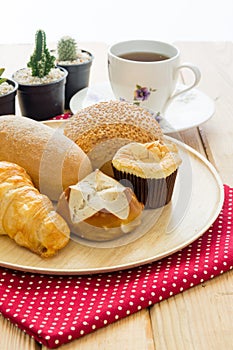 Various bun and bread on wood table