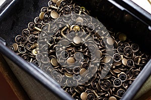 Various buttons and rivets, used for the production of leather articles