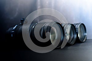 Various camera lenses for digital cameras arranged on a separate black background