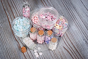 Various candy sprinkles in tiny storage cases