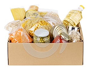 Various canned food, pasta and cereals in a cardboard box