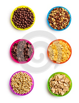 Various cereals in colorful bowls