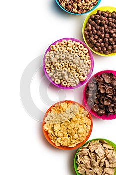 Various cereals in plastic bowls