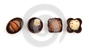 Various chocolate candies isolated on white background. View from above