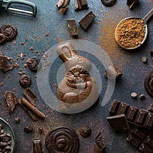 Various chocolate pieces with a chocolate bunny in the middle.