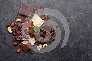 Various chocolate pieces, coffee beans and nuts