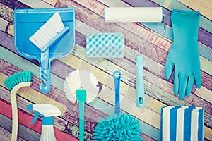 Various cleaning tools placed on a colorful table