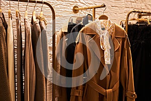 Various coats collection on rack in clothing store