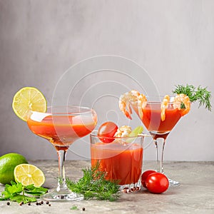 Various cocktails made from tomato juice, shrimp, bloody Mary and the ingredients of tomato, lime, shrimp, celery.