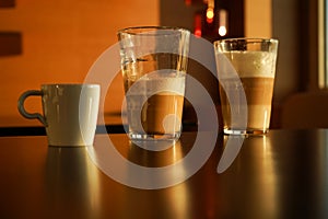 various coffee-based drinks photographed in the sunset light