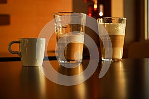 various coffee-based drinks photographed in the sunset light photo